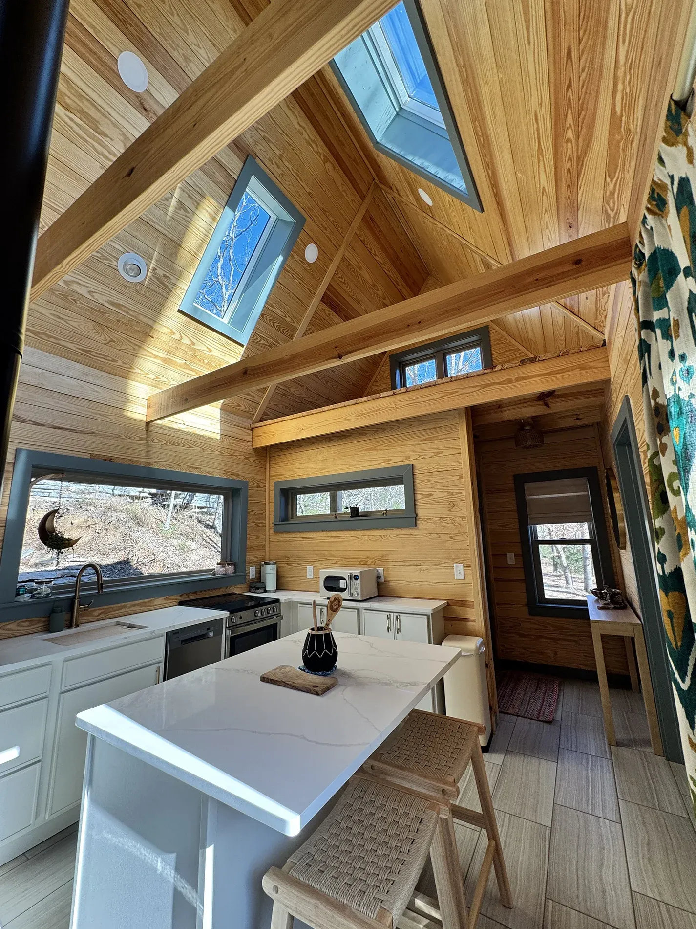 Cabin kitchen with natural wood cabinetry