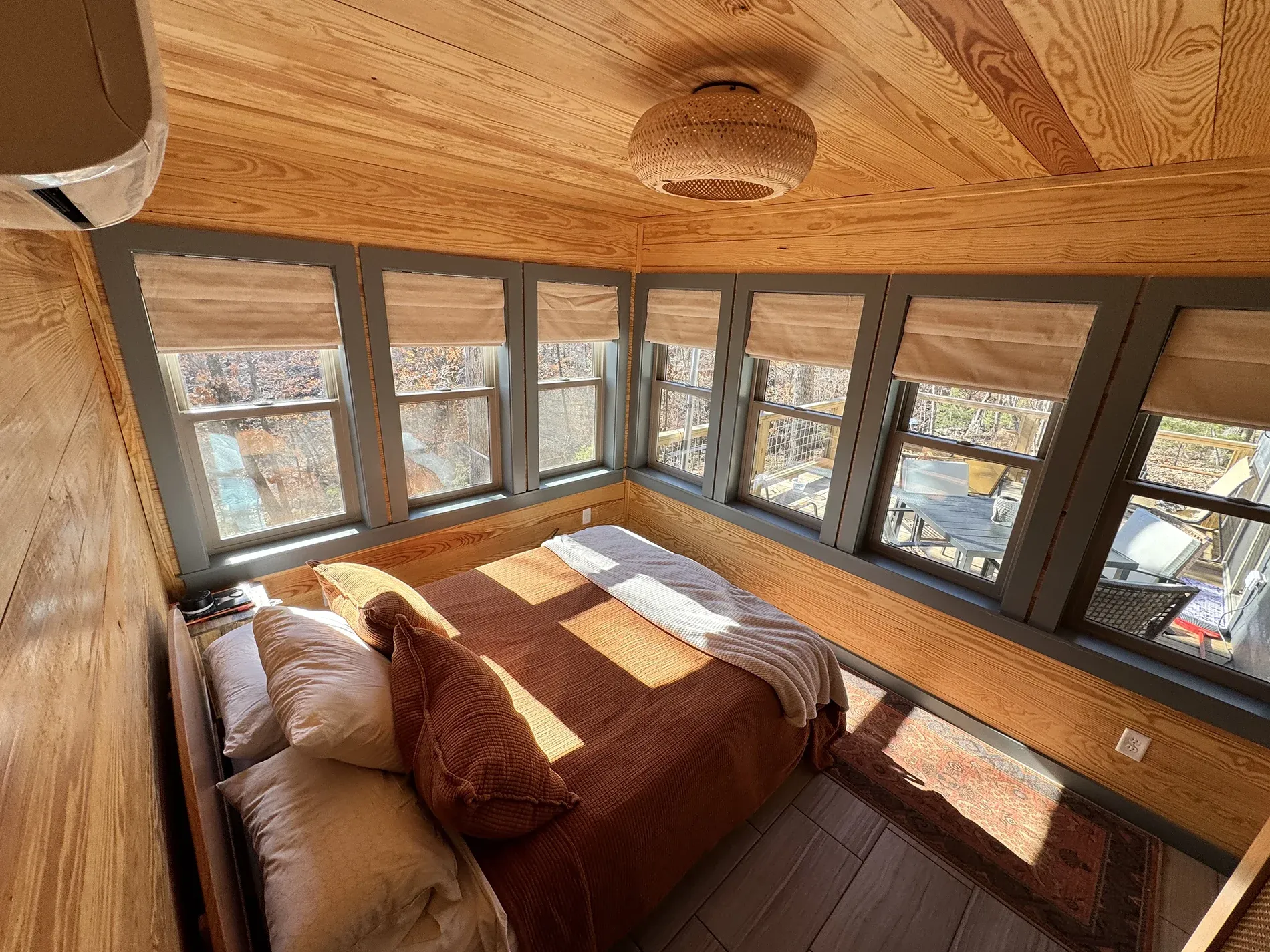 King bedroom with layered linens and blackout curtains